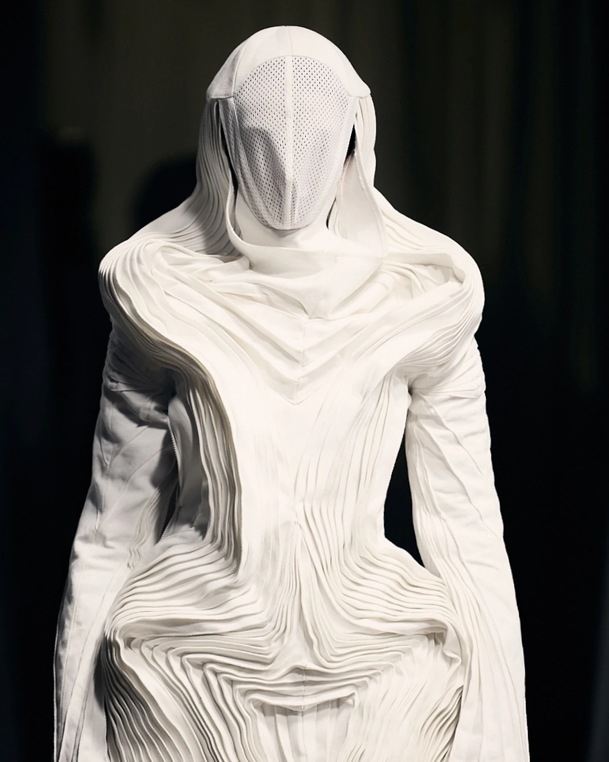 C.PROTOCOL SS27 — sculptural white pleats, garment view