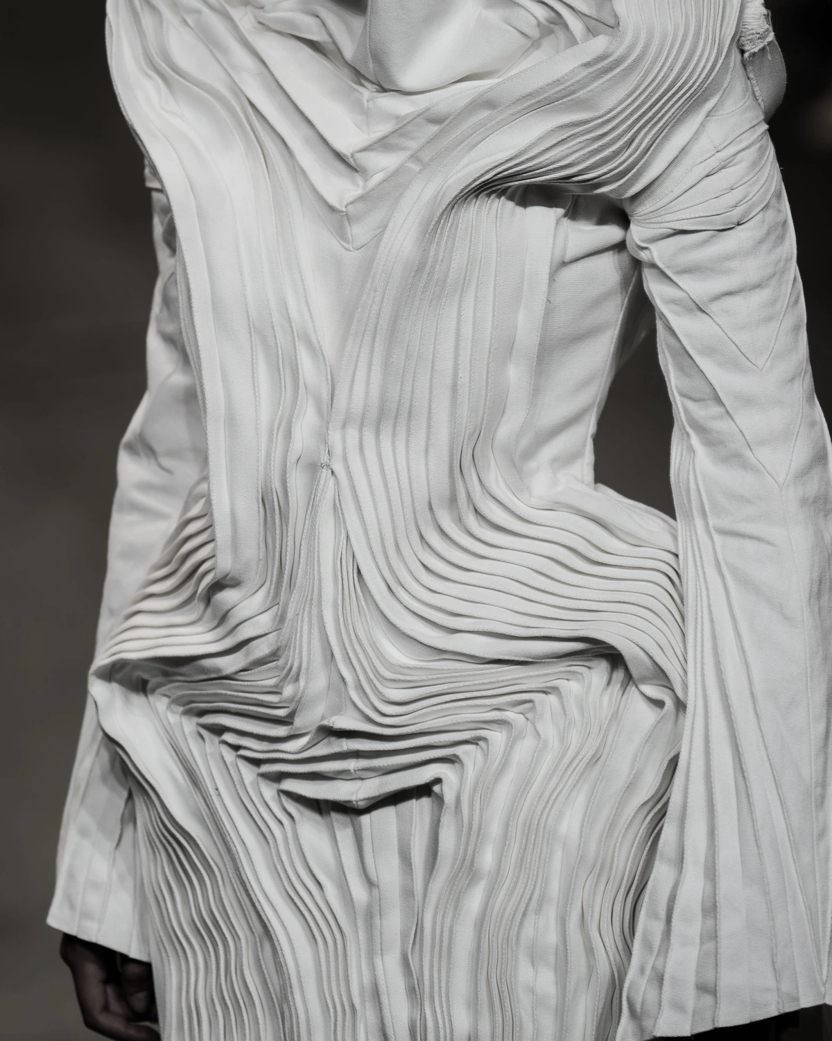 C.PROTOCOL SS27 — sculptural white pleats, alternate view and detail